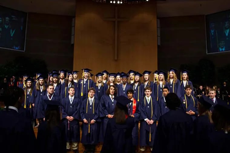 A choir sings at the Brookfield East High School graduation ceremony at Elmbrook Church Saturday, June 6, 2009, in Brookfield, Wis. A federal judge ruled Tuesday that the school district may continue to hold its graduation ceremonies in the church because the location doesn't necessarily make it a religious event. (AP Photo/Morry Gash, file)