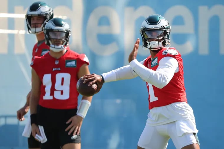 Philadelphia Eagles quarterback Jalen Hurts (right) throws during practice at the NovaCare facility in Philadelphia, Pa. on Sunday, Aug. 20, 2023.