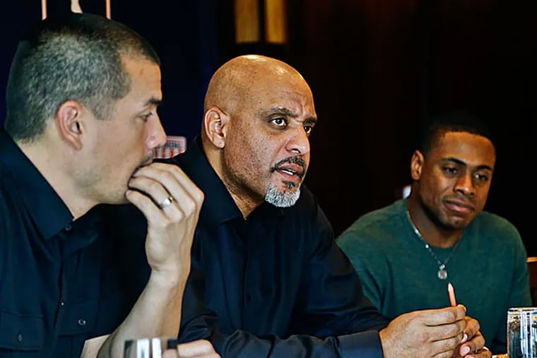 Tony Clark, the Executive Director of the Major League Baseball Players Association, center, sits with Curtis Granderson, right, and Jeremy Guthrie, left, as he answers questions during a news conference at the organizations' annual meeting on Tuesday, Dec. 3, 2013, in San Diego. (Lenny Ignelzi/AP file)