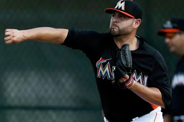 Miami Marlins starting pitcher Ricky Nolasco throws a bullpen session during spring training baseball in Jupiter, Fla. Nolasco has won at least 10 games for the Marlins six times and is their career leader in victories. And now, by default, he's their ace. (Julio Cortez/AP)