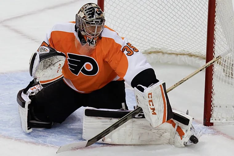 Philadelphia Flyers goalie Steve Mason makes a save against the New York Islanders. (Laurence Kesterson/AP)
