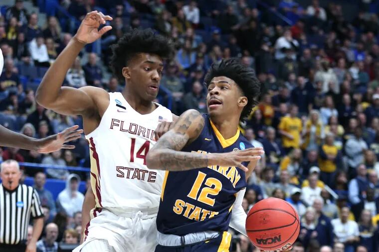 Terance Mann (left) defending Ja Morant of Murray State during a second-round NCAA Tournament game in March.