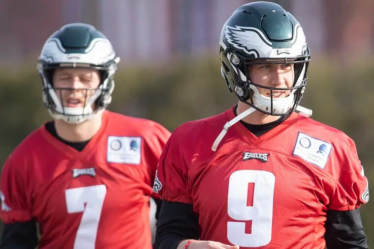 Nick Foles (right) took first-team reps during practice on Wednesday. He and Nate Sudfeld are the only two quarterbacks on the Eagles' roster.