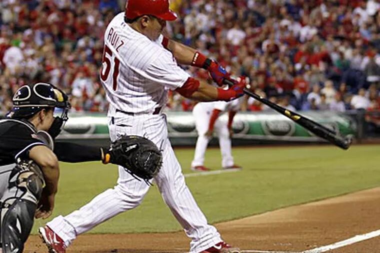 Carlos Ruiz drives in a run in the first inning against the Marlins on Tuesday. (Yong Kim/Staff Photographer)