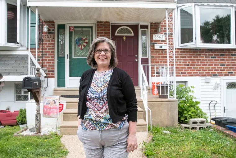 Marci Schwartz, outside of her Northeast Philadelphia home, is a massage therapist who is starting to spend more now that her income has recovered from the pandemic.