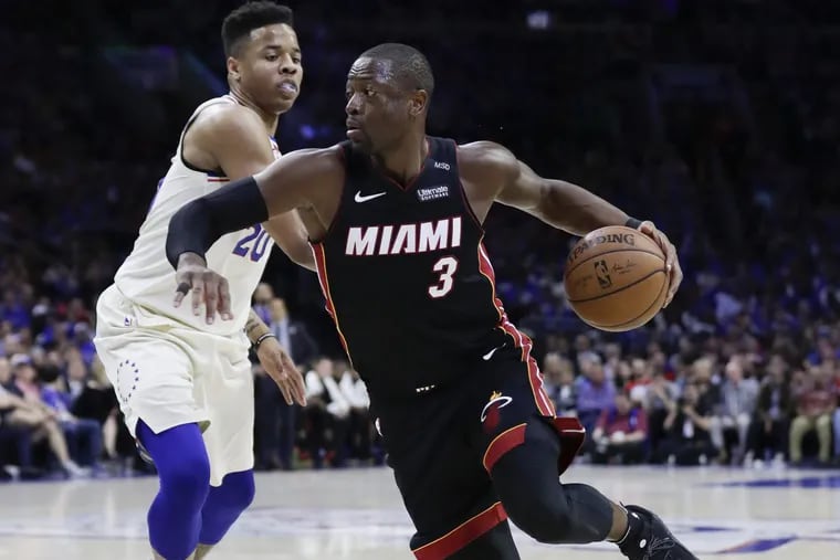Heat guard Dwyane Wade drives past Sixers’ rookie Markelle Fultz during the Sixers’ Game 1 win over the Heat on Saturday.