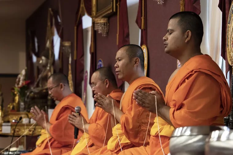 Monks chant in the Pali language at Wat Mongkoltepmunee Theravada Buddhist temple in Bensalem.