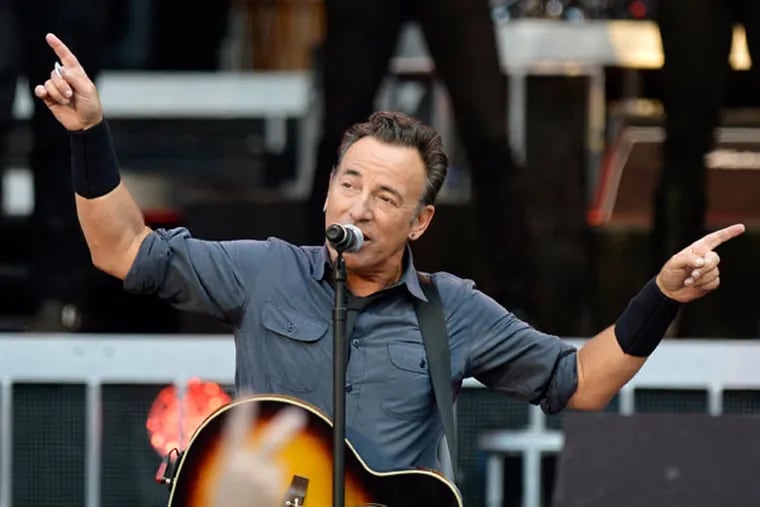 In this picture made available Thursday, July 4, 2013, U.S singer Bruce Springsteen & The E Street Band perform during a concert at the Stade de Geneve stadium in Geneva, Switzerland, Wednesday, July 3, 2013. (AP Photo/Keystone, Martial Trezzini)