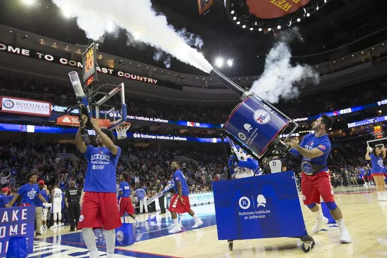 With lots of enthusiasm for the upcoming season, the job of marketing the Sixers has become eaasier. The Sixers Dunk Squad fires T-shirts into the crowd during a preseason game against the Memphis Grizzlies on Oct. 4, 2017. CHARLES FOX / Staff Photographer
