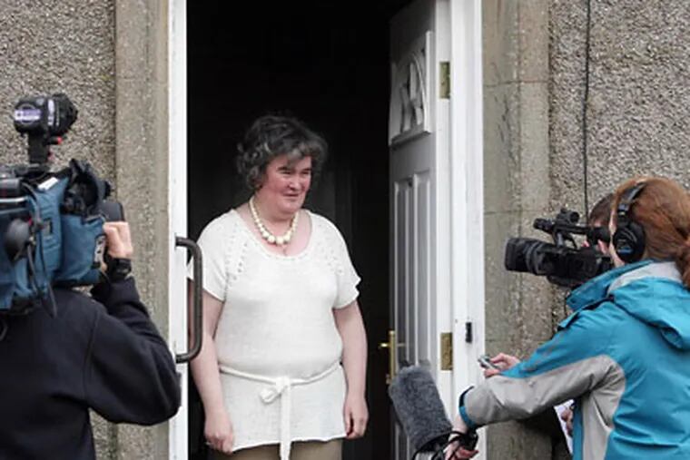 Susan Boyle, whose performance on the television show "Britain's Got Talent" wowed the judges, faces the media at her home in Blackburn, Scotland.(AP Photo/Andrew Milligan-pa)
