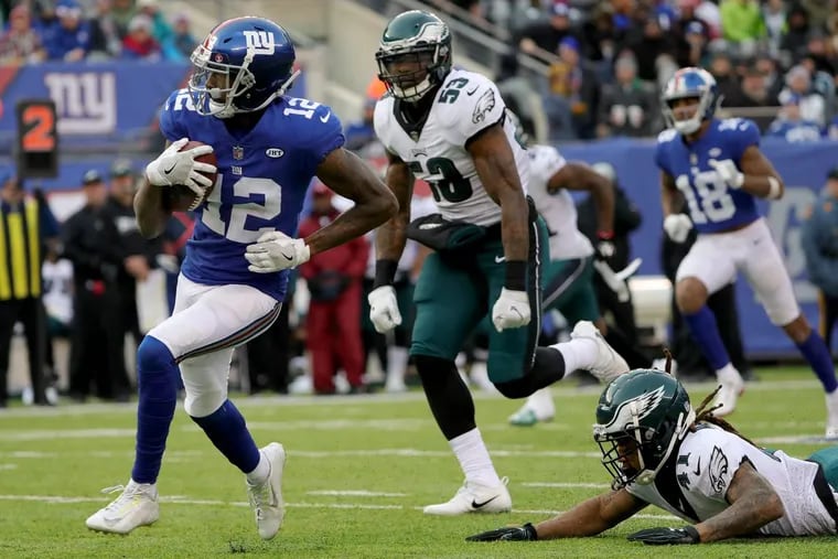 Nigel Bradham, 53, and Ronald Darby, 41, couldn’t catch Giants wide receiver Tavarres King on his way to a touchdown in the third quarter on Sunday. DAVID MAIALETTI / Staff Photographer