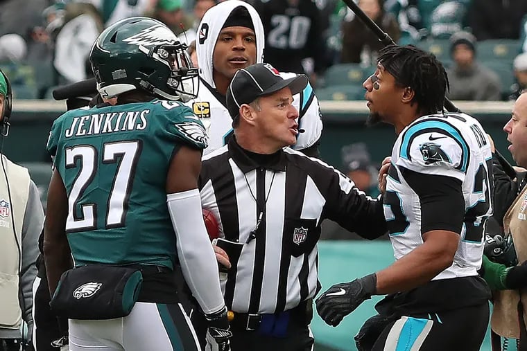 Malcolm Jenkins (left) and Eric Reid argue during the coin toss.