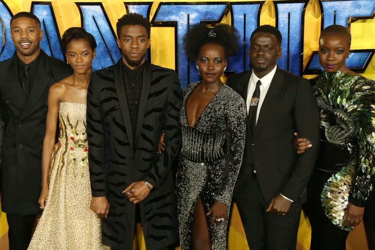 FILE - In this Feb. 8, 2018 file photo, actors Michael B. Jordan, Leitia Wright, Chadwick Boseman, Lupita Nyong'o, Daniel Kaluuya and Danai Gurira pose for photographers upon arrival at the premiere of the film "Black Panther" in London. Boseman, who played Black icons Jackie Robinson and James Brown before finding fame as the regal Black Panther in the Marvel cinematic universe, has died of cancer. His representative says Boseman died Friday, Aug. 28, 2020 in Los Angeles after a four-year battle with colon cancer. He was 43.