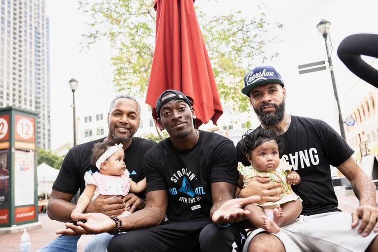Sean Williams, center, at a "Strollin' with the Homies" event in Atlanta last year with Fadelf Jackson, left, Chris Classic and their daughters.