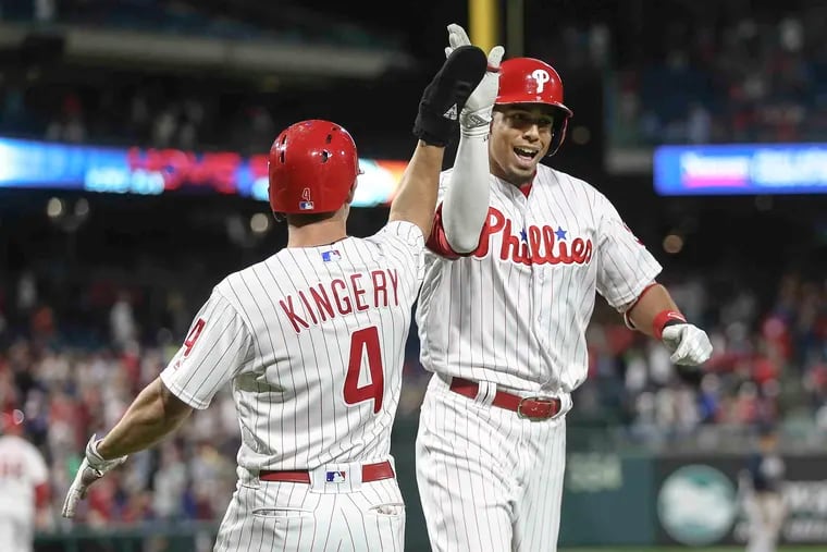 Pinch hitting for Phillies' pitcher Nick Pivetta, Aaron Altherr celebrates his two run home against the Braves with Scott Kingery who he brought in during the 7th inning at Citizens Bank Park in Philadelphia, Monday, May 21, 2018.  Phillies shutout the Braves 3-0.   STEVEN M. FALK / Staff Photographer