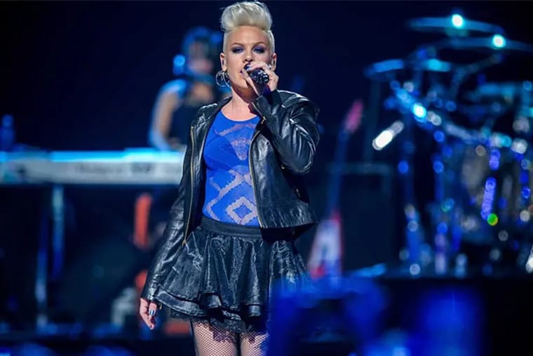 FILE-- P!nk performs at iHeart Radio Music Festival on Saturday, Sept., 22, 2012 at the MGM Grand Arena in Las Vegas. (Photo by Eric Reed/Invision/AP)