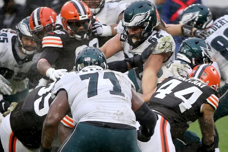 Eagles center Jason Kelce (center) injured his left elbow on this play in the second quarter against the Browns on Sunday. He had the elbow examined and, not surprisingly, returned to the game.
