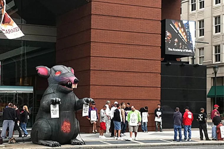 Members of Local 8 of the International Alliance of Theatrical Stage Employees gather in front of the Kimmel Center in a strike that was interrupted after 18 hours. (PETER DOBRIN / Staff)