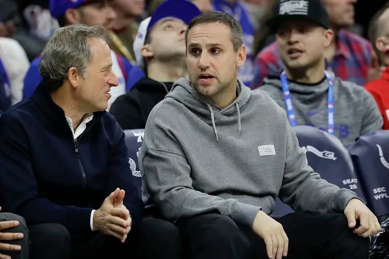Sixers partner Michael Rubin (right) with managing partner Josh Harris courtside at a game.