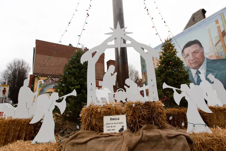 Pieces of a wooden nativity scene in the Italian Market in South Philly were stolen Saturday morning. Police later recovered them. The investigation continues. MARGO REED / Staff Photographer