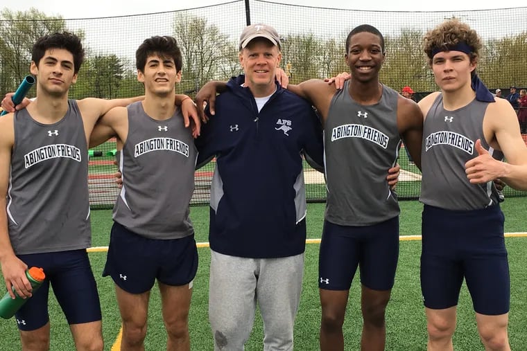Abington Friends School 1,600 medley relay team with coach Kyle Rankin (middle). From left, Chase Balick, Jack Balick, Taalib Holloman and Sam Shally.