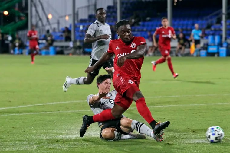 Toronto FC's Ayo Akinola, front, scored a hat trick against the Montreal Impact.