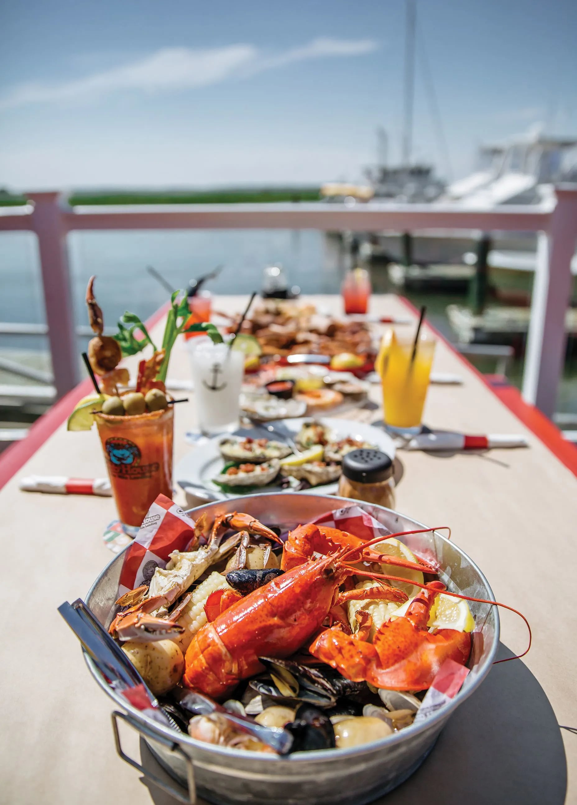 Brunch cocktails and a spread of seafood at The Crab House, part of Two Mile Landing in Wildwood Crest, NJ.