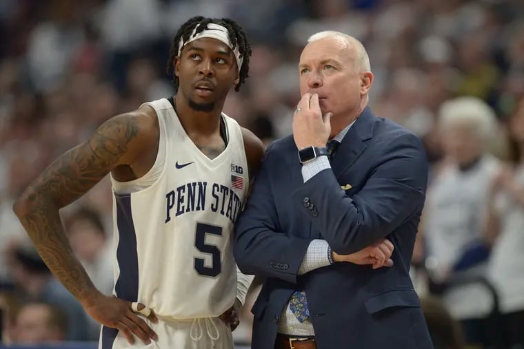 Penn State coach Patrick Chambers, right, confers with Jamari Wheeler (5) in the final minutes of play against Minnesota on Feb. 8. The Nittany Lions are still feeling the sting of having their breakthrough season cut short.