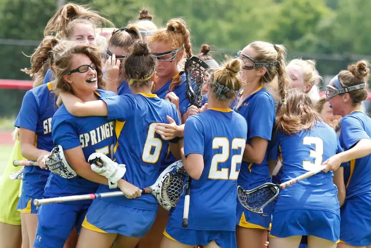 Goalie Dana Mirigliano (left, with glasses) and her Springfield (Delco) teammates celebrate after winning the PIAA Class 2A lacrosse championship Saturday, June 8, 2019, at West Chester East. The Cougars defeated Villa Maria in the final, 10-8. LOU RABITO / Staff.