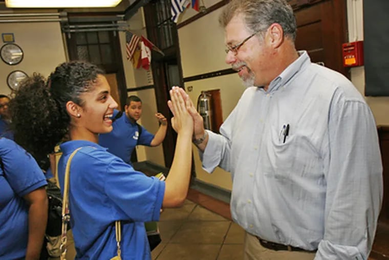 Math teacher Brian Malloy gets a good-luck high-five from Bodine High 11th-grader Nilofar Kazi on the day before he was named teacher of the year. He is a 30-year veteran of the district’s classrooms. (Alejandro A. Alvarez / Staff Photographer)