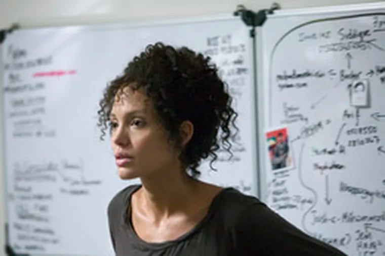 Actress Angelina Jolie , who claims some mixed ancestry, darkened her skin to appear as the multiracial Mariane Pearl in the movie &quot;A Mighty Heart.&quot;