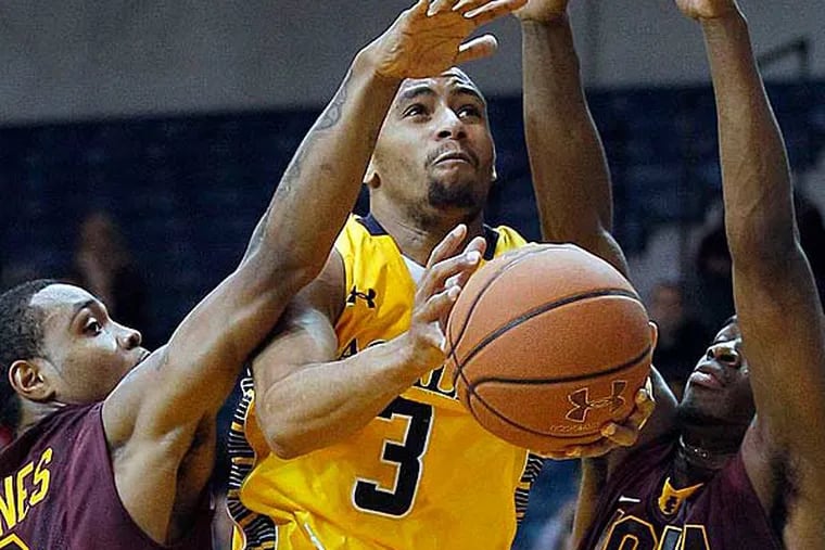 La Salle's Tyreek Duren drives to the basket against Iona's Lamont
Jones (left) and Sean Armand during the first half on Thursday, December 20, 2012. (Yong Kim/Staff Photographer)