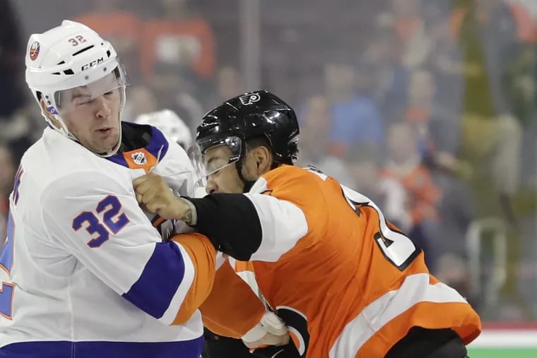 Flyers left winger Tyrell Goulbourne fights with New York Islanders left winger Ross Johnston during a preseason game Sept. 17.