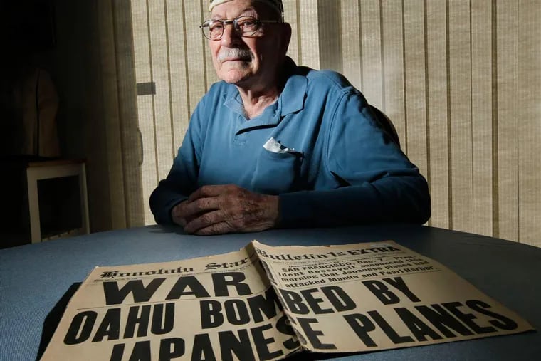 Benjamin Lichtman, 93, with the Honolulu Star-Bulletin from Dec. 8, 1941. His battleship, the USS West Virginia, was hit by seven torpedoes and sunk.
