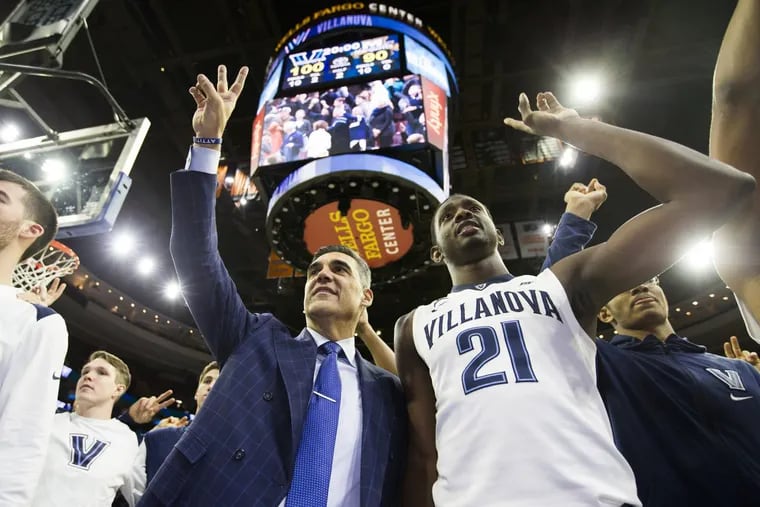 Coach Jay Wright of Villanova and team salute the student section after their 100-90 victory over Marquette at the Wells Fargo Center on Jan 6, 2018. It was Wright’s 400th win at Villanova.