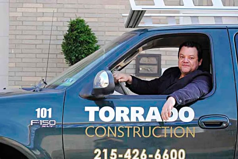 Philly native Luis Torrado has been watching his biz, Torrado Contruction Co., grow since 1996. (Gabriela Barrantes / Staff photographer)