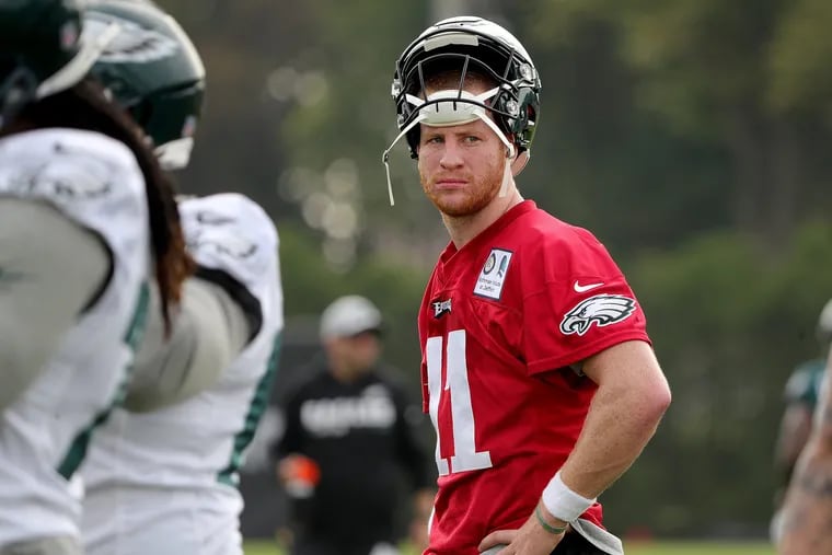 Eagles' Carson Wentz pauses during the Philadelphia Eagles training camp at the NovaCare Complex on July 27, 2018 in Philadelphia, PA. DAVID MAIALETTI / Staff Photographer