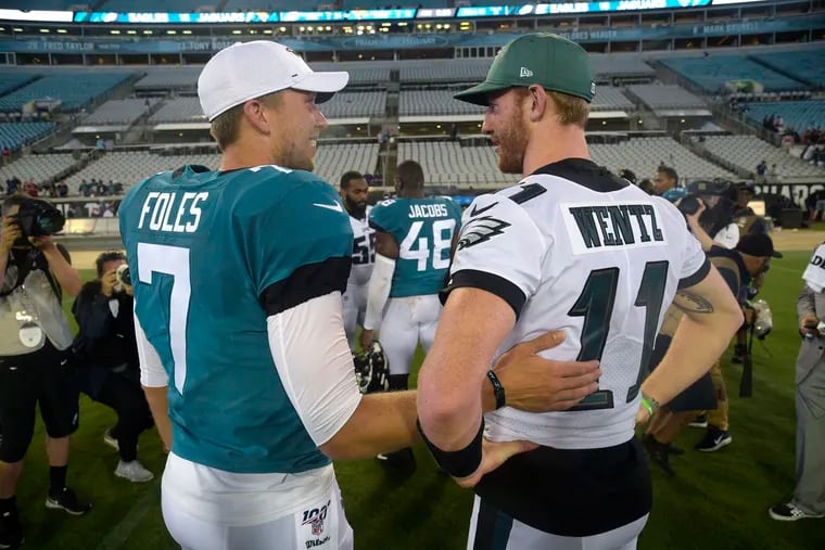 Nick Foles (left) and Eagles quarterback Carson Wentz, here chatting after a 2019 preseason game, could meet again in the 2019-20 playoffs.