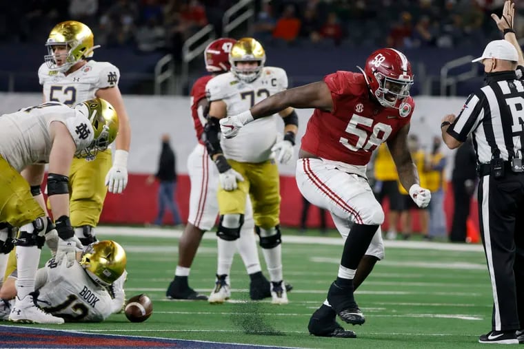 Neumann-Goretti grad Christian Barmore, shown celebrating a sack in Alabama's playoff win over Notre Dame, is the top-rated defensive tackle in the 2021 draft.