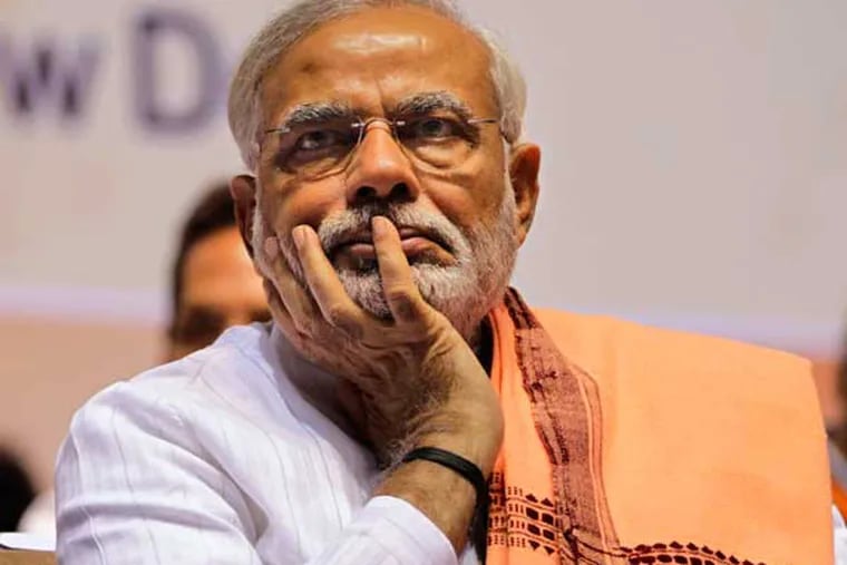India's main opposition Bharatiya Janata Party (BJP) leader Narendra Modi attends a party meeting in New Delhi, India, Saturday, March 2, 2013. The two-day long national council meeting of the BJP began Saturday. (AP Photo/Altaf Qadri)