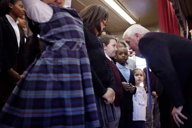 At the event at St. Martin of Tours school in Summerdale, Gov. Corbett talks with third grader Bryant Howe. &quot;As long as I'm governor, I'm going to be watching what you are doing,&quot; he said. MICHAEL S. WIRTZ / Staff Photographer