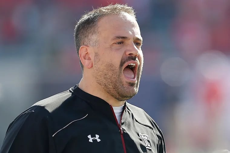 Temple Owls head coach Matt Rhule walks the sidelines while the Owls play the Houston Cougars in the first half in the Mid-American Conference football championship game at TDECU Stadium.