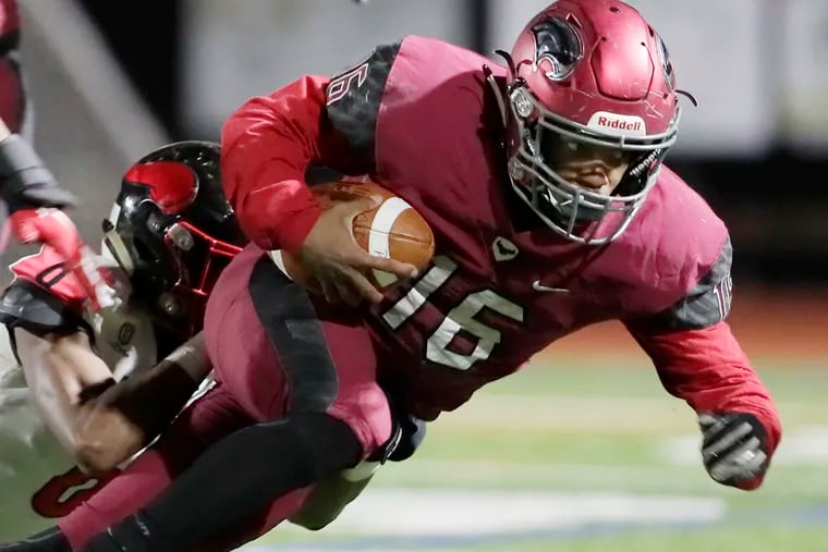 St. Joseph's Prep quarterback Malik Cooper dives for yardage in the 2019 Class 6A city title game against Northeast.