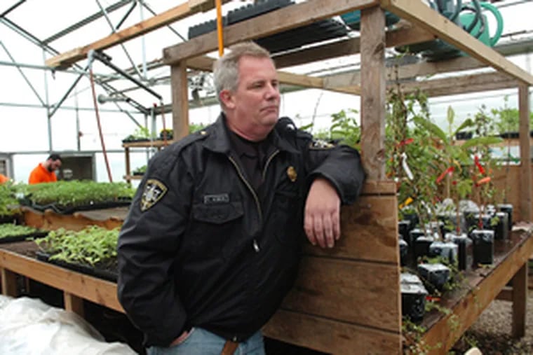Corrections officer Tom O&#0039;Neal manages the greenhouse. Gardening is goal-oriented, he said, yet requires patient and persistent care. Life lessons abound for those who till soil.