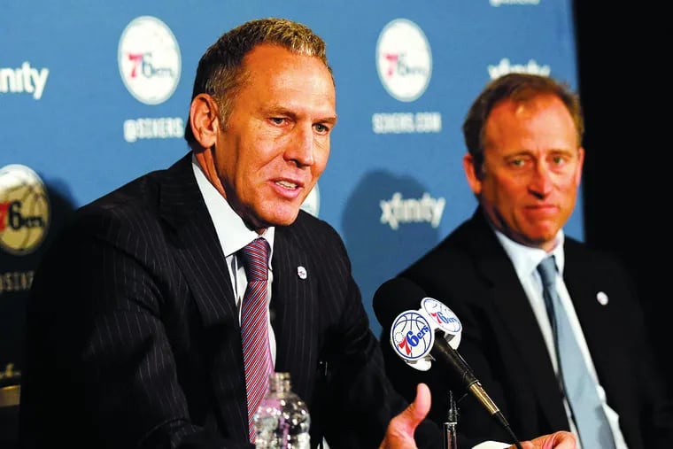 Bryan Colangelo speaks to the media with owner Josh Harris after being named president of basketball operations on April 10, 2016. 
