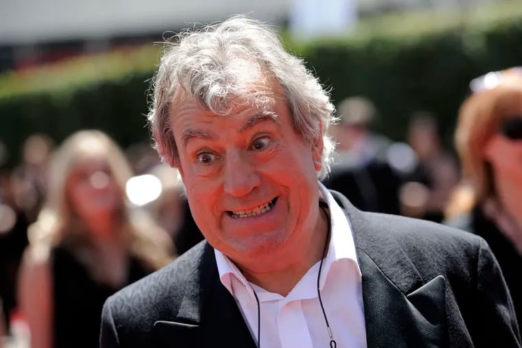 Terry Jones arrives at the Creative Arts Emmy Awards in Los Angeles. Terry Jones, a member of the Monty Python comedy troupe, has died at 77. Jones's agent says he died Tuesday Jan. 21, 2020.