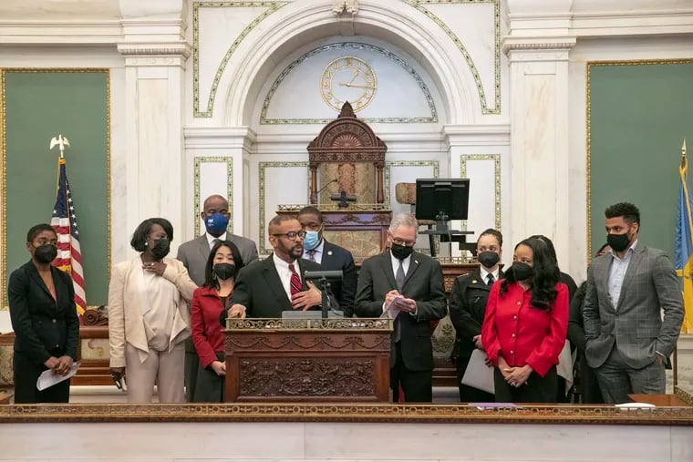 Councilmember Curtis Jones Jr. speaks during a news conference on the release of a report about the city's ongoing gun violence at City Hall.
