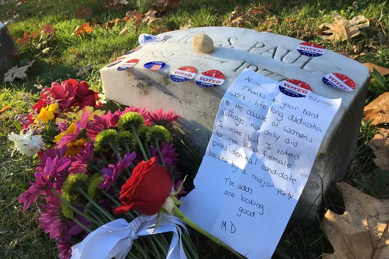 Tributes and flowers piled up at the gravesite of suffragist Alice Paul at the Westfield Friends Cemetery in Cinnaminson NJ.