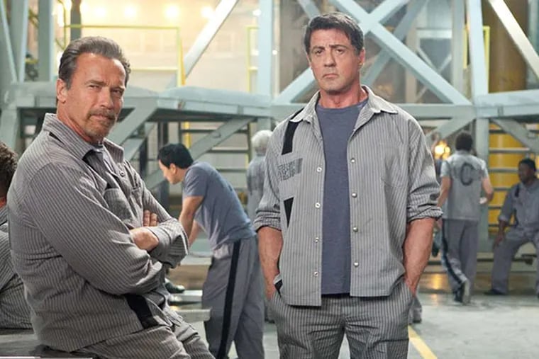 (L-R) Arnold Schwarzenegger and Sylvester Stallone star in ESCAPE PLAN.  (Alan Markfield. © 2013 Summit Entertainment, LLC)