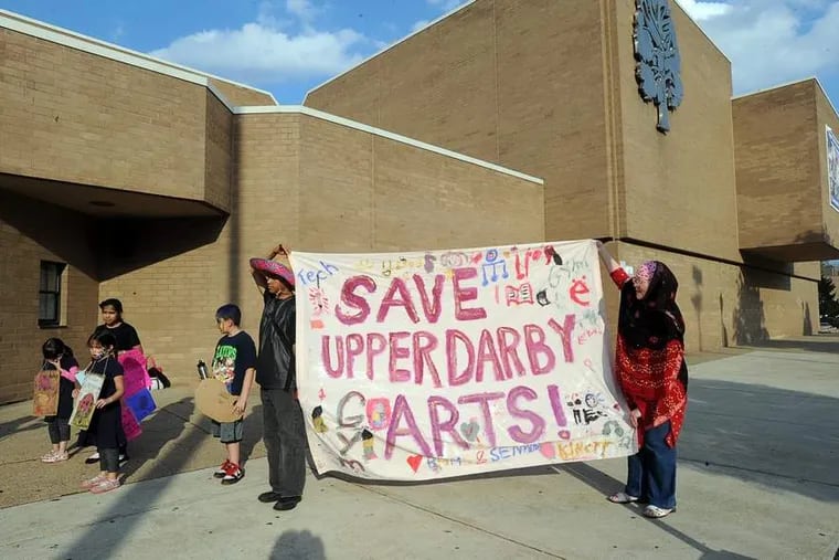 Parents and others protest proposed cuts to arts and music programs outside Upper Darby High School before a  school board meeting. SHARON GEKOSKI-KIMMEL / Staff Photographer